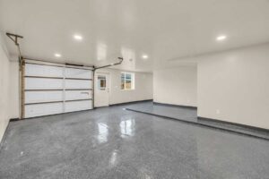 City Park Restoration, UT 8 A garage featuring a large main door alongside two smaller white doors.