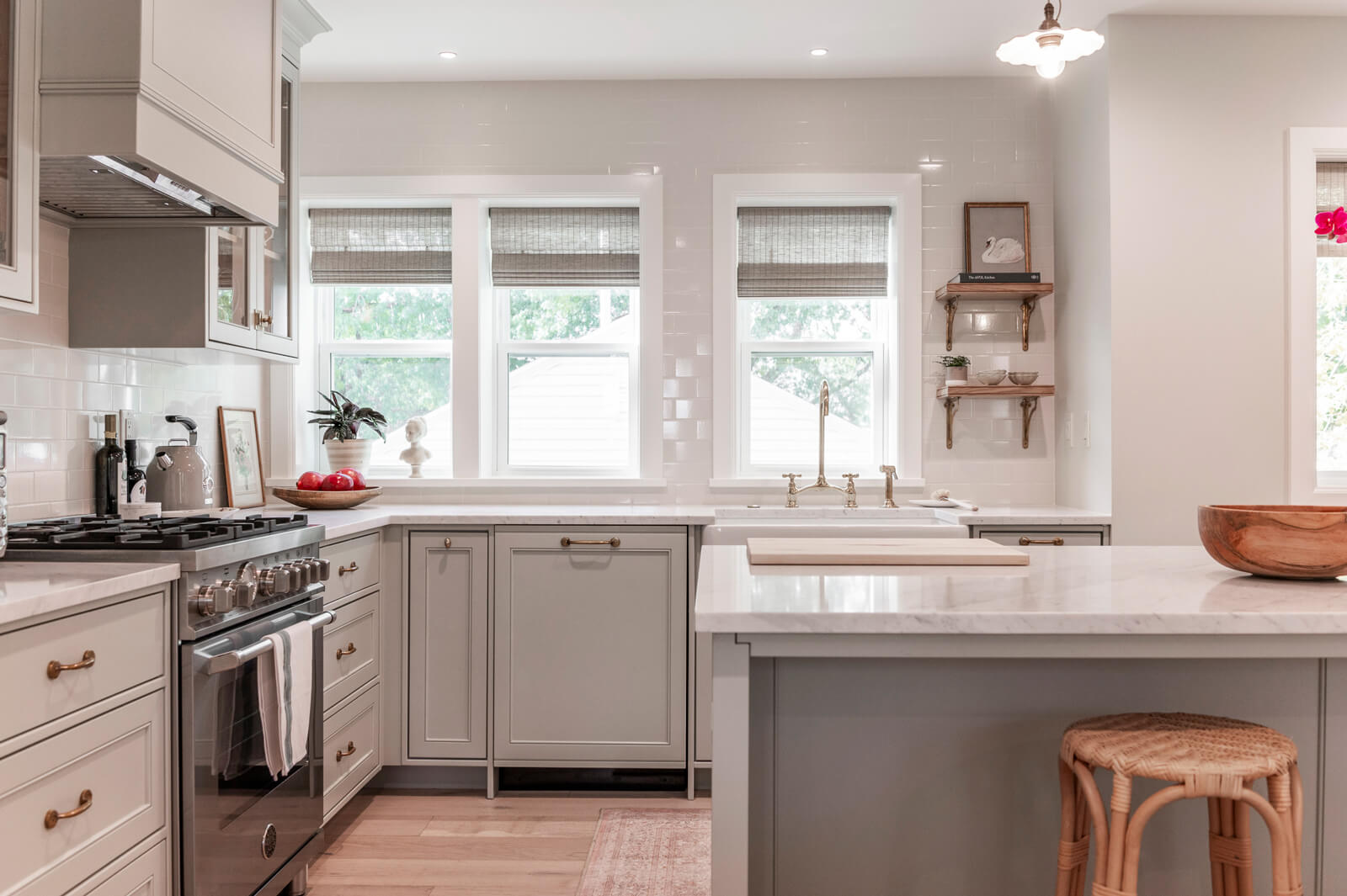29-1751-s-2100-e Modern kitchen interior with grey cabinets, white countertops, and natural light.