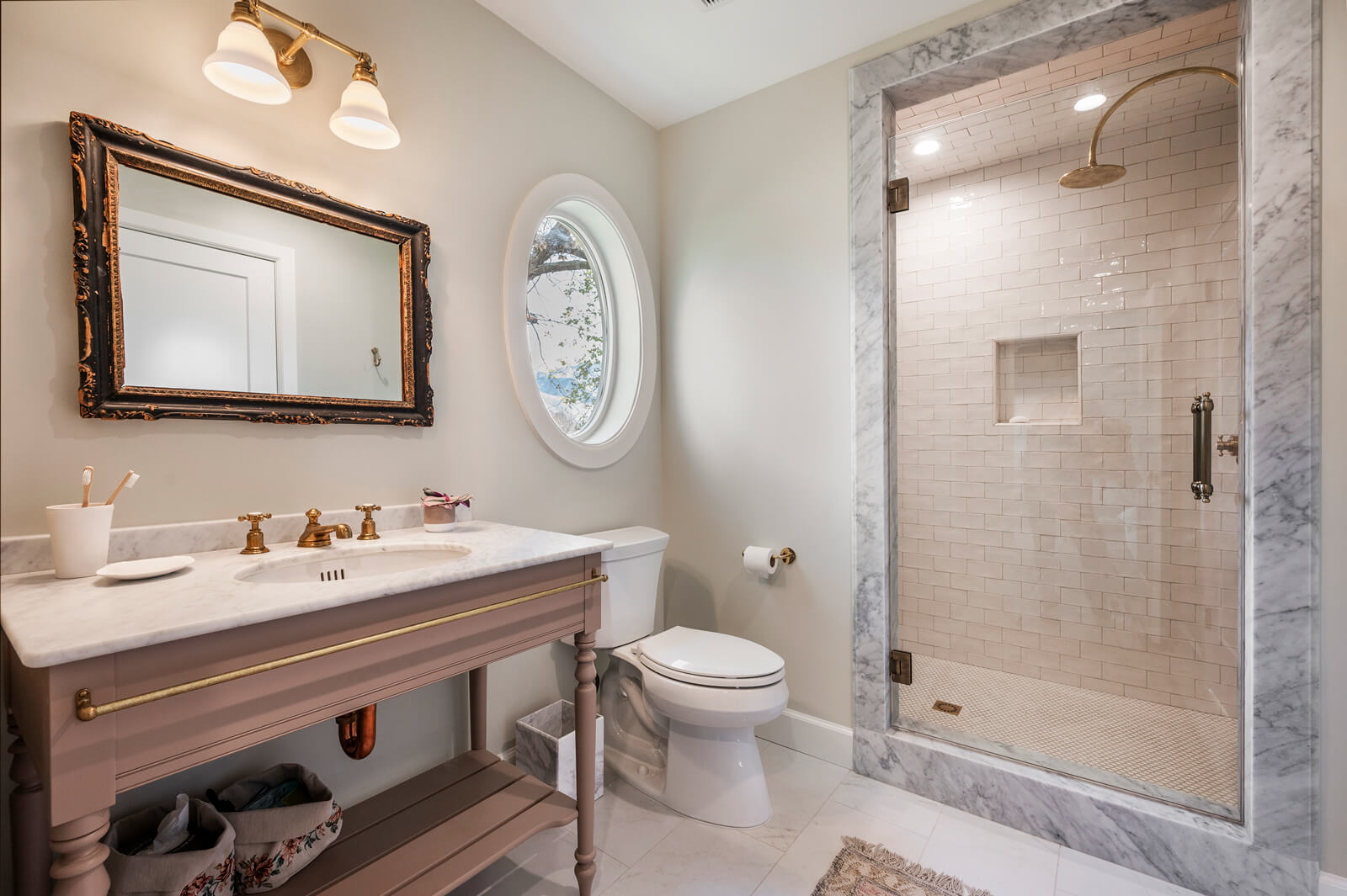Modern bathroom with marble shower area.