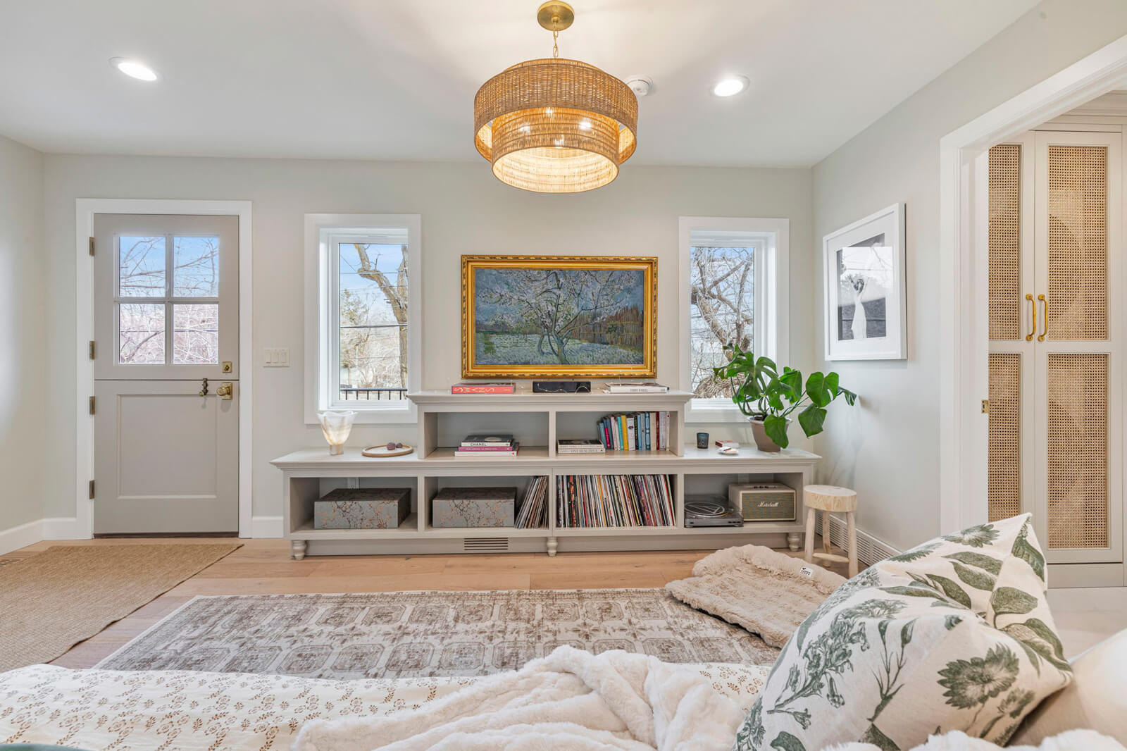 A cozy living room featuring a plush rug and a comfortable couch, creating a welcoming atmosphere for relaxation.