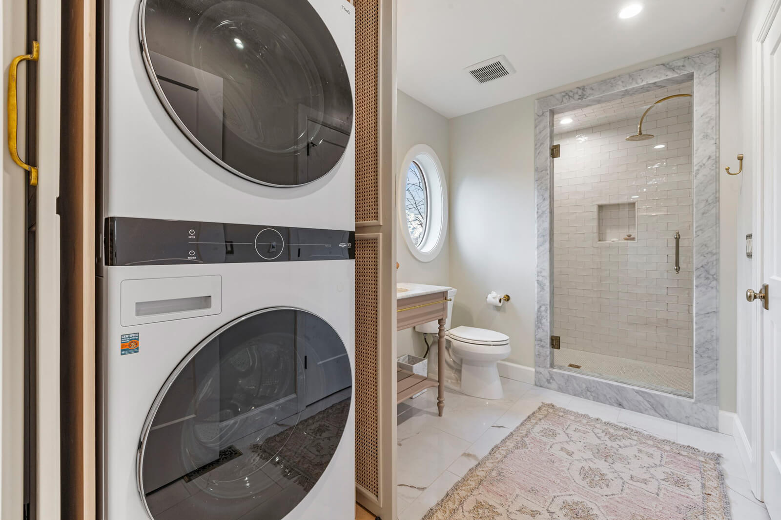 A clean laundry room featuring a modern washer and dryer, organized and ready for use.