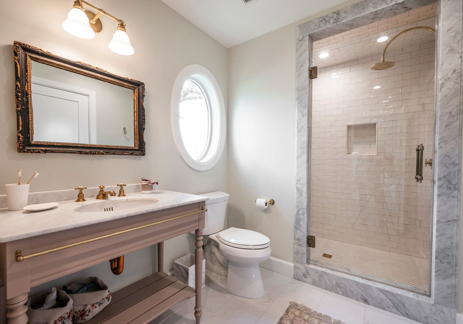 Modern bathroom with marble shower area.
