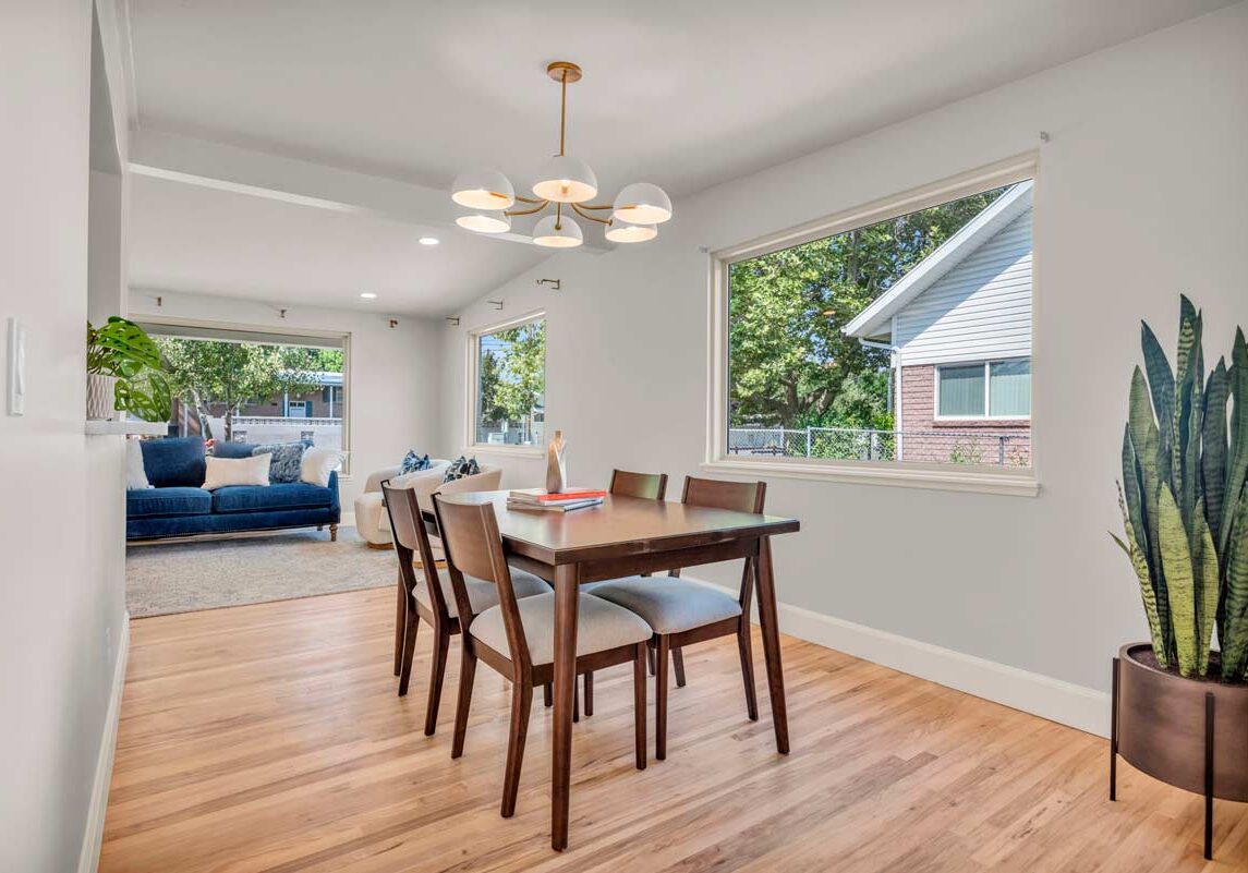 A dining room featuring a table surrounded by chairs, creating an inviting space for meals and gatherings.